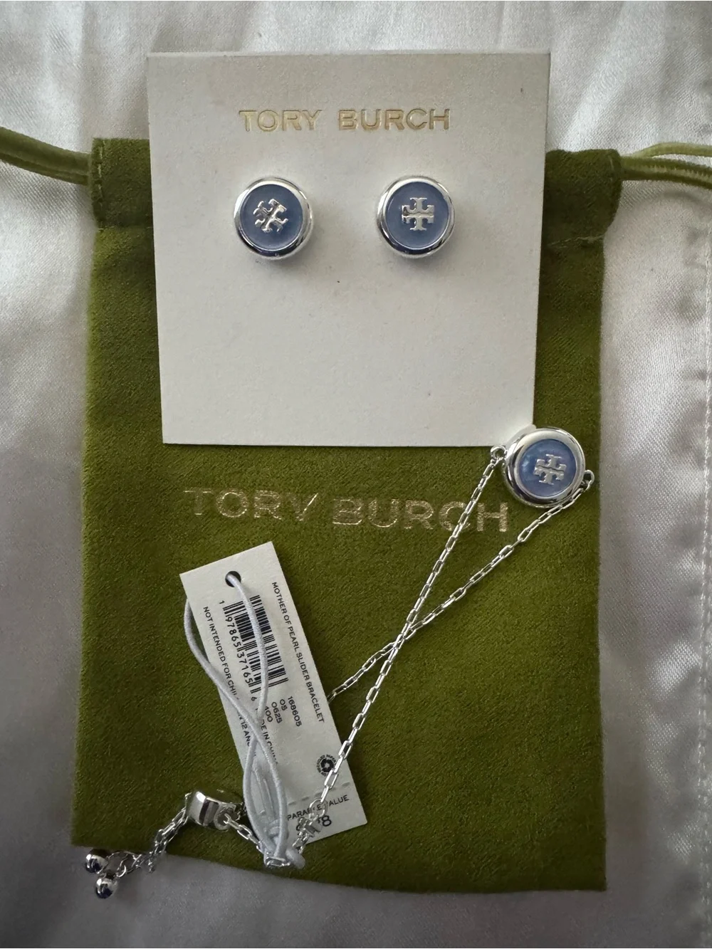 Tory Burch Light Blue Enamel Logo Studs and bracelet set.